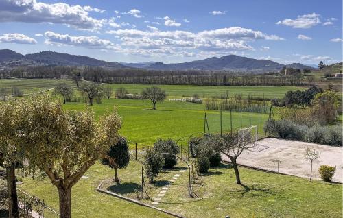 a view of a field with trees and a basketball hoop at Umbria Magione Podere C in Magione