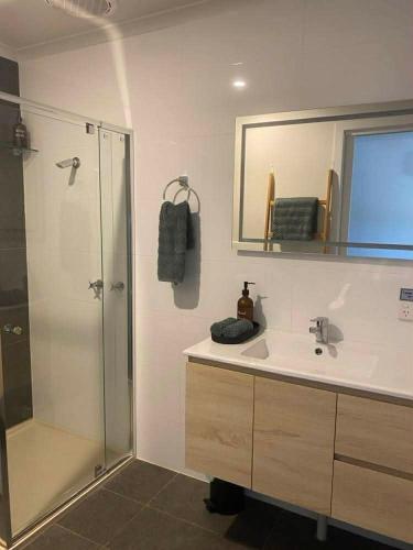 a bathroom with a sink and a shower at Noojee views - cozy studio in Noojee