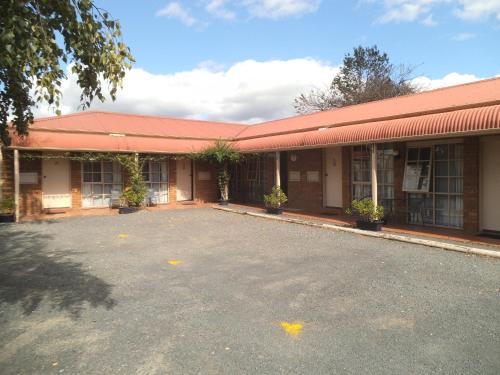 
a large brick building with a large window at Yarragon Motel in Yarragon

