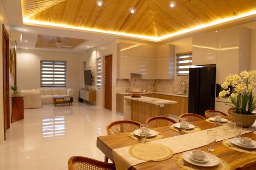 a kitchen and living room with a table and chairs at Casa Mithi Private Villas Resort in Mexico