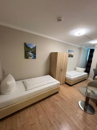 Voodi või voodid majutusasutuse Hotel Pension Eberty toas