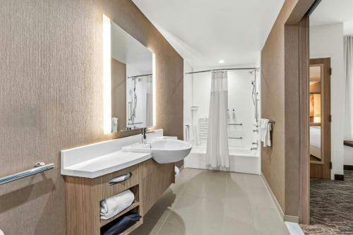 a bathroom with a white sink and a mirror at SpringHill Suites by Marriott Columbus West in Columbus