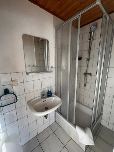 a bathroom with a sink and a shower at Bungalow Beate in Zinnowitz