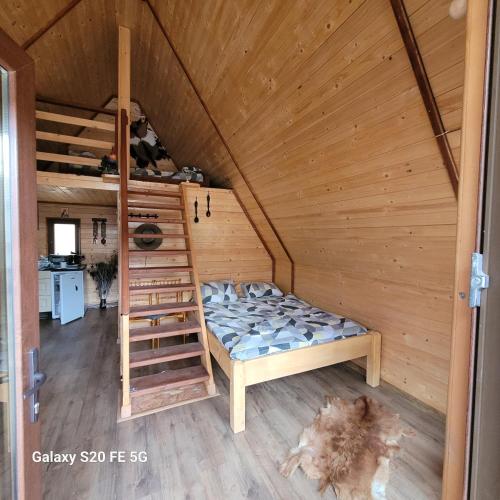 Llit o llits en una habitació de Cabanele lui Sem