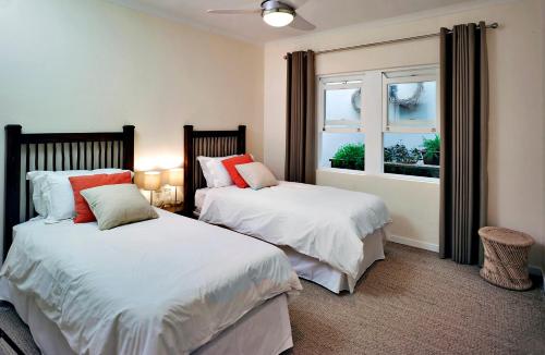 Ένα ή περισσότερα κρεβάτια σε δωμάτιο στο umSisi Cottage