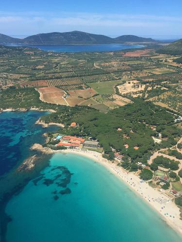 an aerial view of a beach and the ocean at Hotel Dei Pini in Alghero