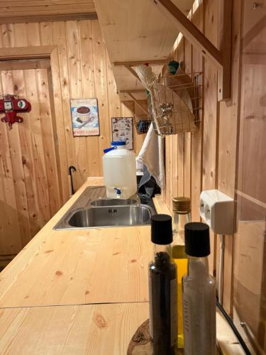 a kitchen with a sink and a counter top at Musekroken in Elverum