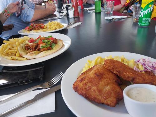 a table with three plates of food on it at NATURE LOVERS ADVENTUREs in Maasai Mara National Reserve