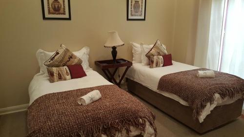 Katil atau katil-katil dalam bilik di Copperpot Guesthouse
