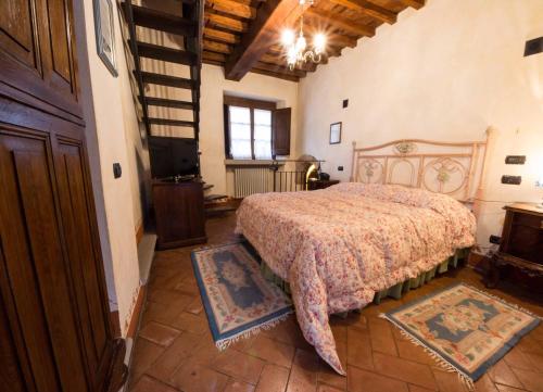 a bedroom with a large bed in a building at Monastery Birbino in Le Ville