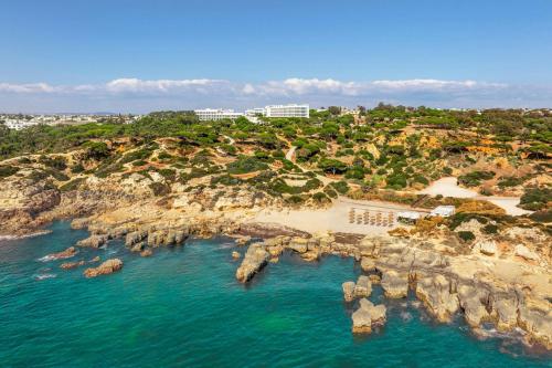 an aerial view of a beach with rocks at W Algarve in Albufeira