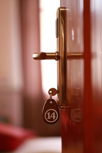 a door with a key tag on it at Khujand Grand Hotel in Khujand