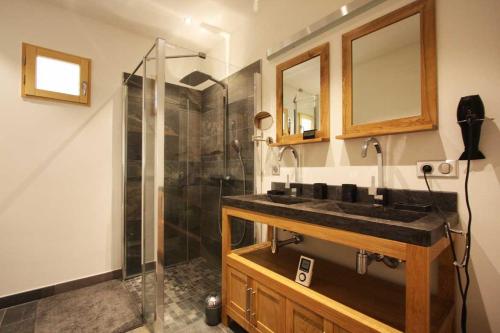 a bathroom with a sink and a shower at Chalet Couttet - Chamonix All Year in Chamonix