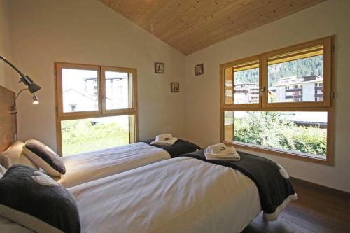 เตียงในห้องที่ Chalet Couttet - Chamonix All Year