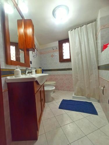 a bathroom with a sink and a toilet at Meraviglie Salentine in Lequile