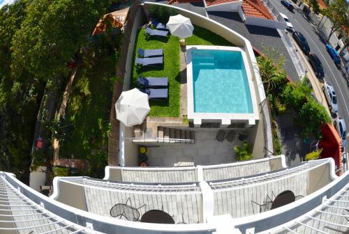 an aerial view of a resort with a swimming pool at VILA TOCA by brugrani in Funchal