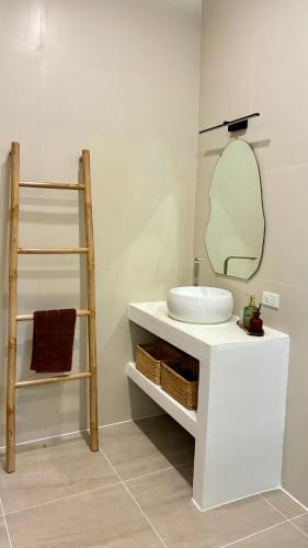 a bathroom with a sink and a mirror at Samma Villas - Onyx Villa - 1 BDR & Private Pool in Ko Phangan