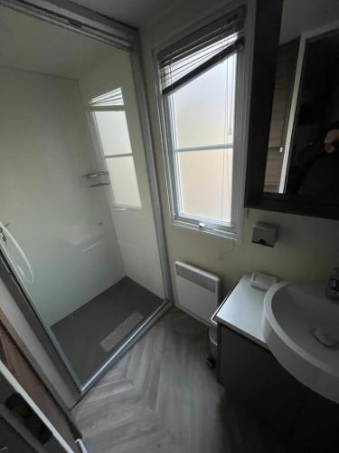 a bathroom with a sink and a mirror at Mobile-home in Gassin