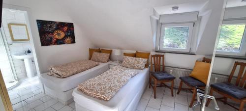 a living room with a couch and chairs in it at Moselhof in Burg