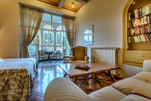 a living room with a couch and a table at Villa Mediteran Old Town, 5 En-Suites and Hot Tub in Dubrovnik