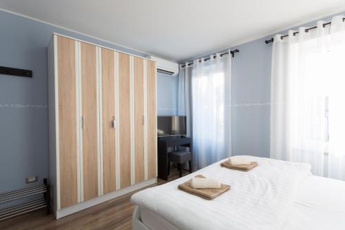Postel nebo postele na pokoji v ubytování Apartment Kancler