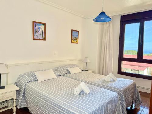 a bedroom with a bed with two pillows on it at Perez del Molino - 5806 in Isla