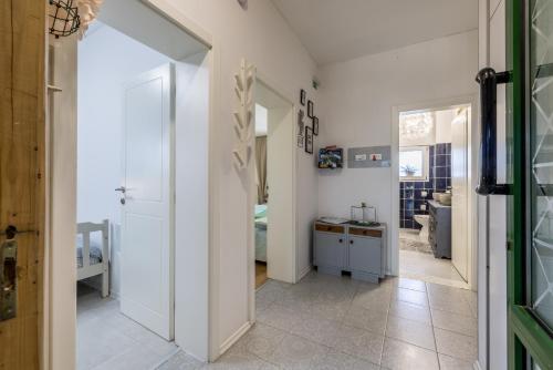 a hallway with a door leading to a bedroom at Holiday house Goran, Opuzen in Opuzen