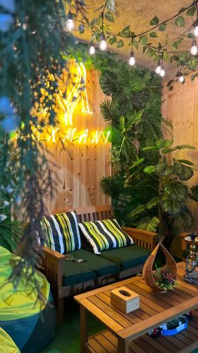 a living room with a couch and a table at Luxmani Hotel & Spa in Tbilisi City