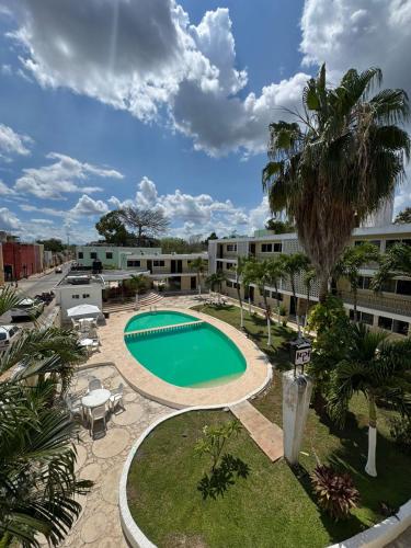 an image of a swimming pool at a resort at Departamentos Naa'y in Valladolid