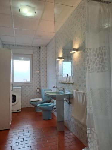 a bathroom with a sink and a toilet and a sink at Torre Plaza 4 in Boiro