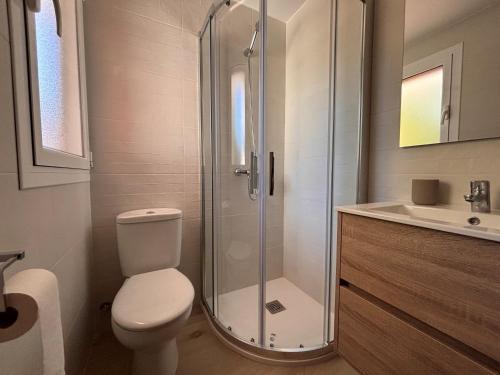 a bathroom with a shower and a toilet and a sink at Mediterranean House in Valencia in Valencia