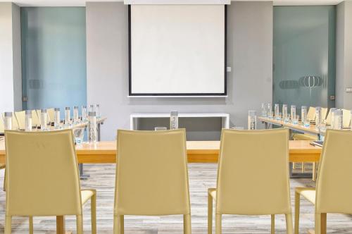 a conference room with a long table and chairs at Barceló Teguise Beach - Adults Only in Costa Teguise
