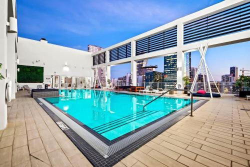 a swimming pool on the roof of a building at Downtown Miami Condo with Balcony & Rooftop Pool in Miami