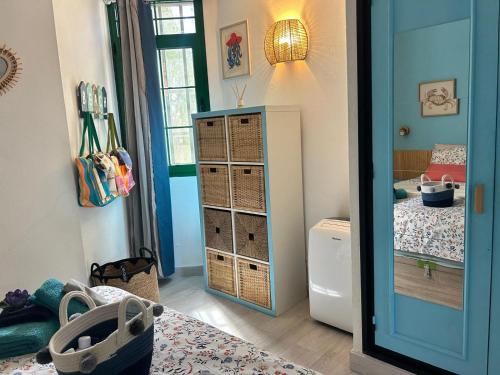 a room with a bedroom with a bed and a mirror at Casa ART residenza Bouganville in Costa de Antigua