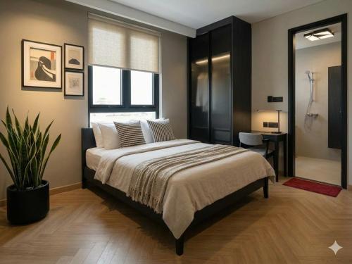 a bedroom with a large bed and a window at Muse Riverside in Ninh Binh