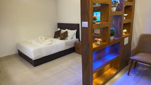 a bedroom with a bed in a room at Ourea's Rest in Thekkady