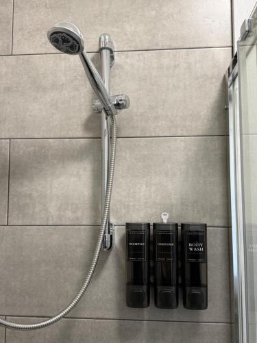a shower head on the side of a wall at Via Veneto in Loreto Aprutino