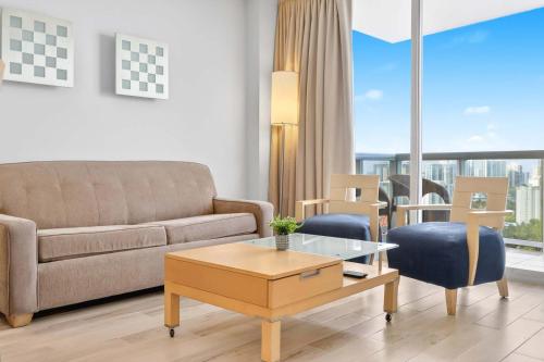 a living room with a couch and a table at Marenas Resort Beachfront Condo with Direct Access in Sunny Isles Beach