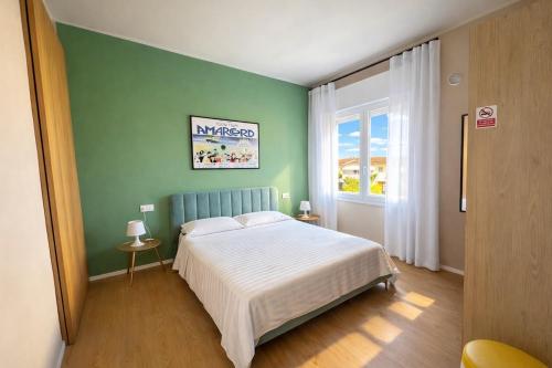 A bed or beds in a room at Loft Monte Cinto 2