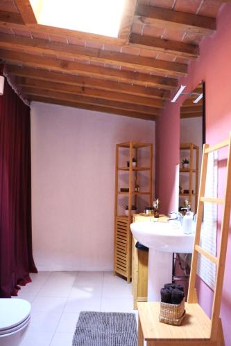 a bathroom with a sink and a toilet at Residenza Toscanini in Ravenna