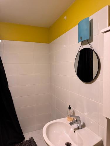 a bathroom with a sink and a mirror at Centre saint malo in Saint Malo