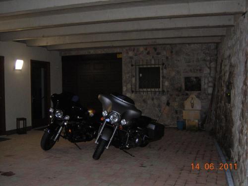 a couple of motorcycles parked in a garage at B&B Ledro AFFITTACAMERE in Mezzolago