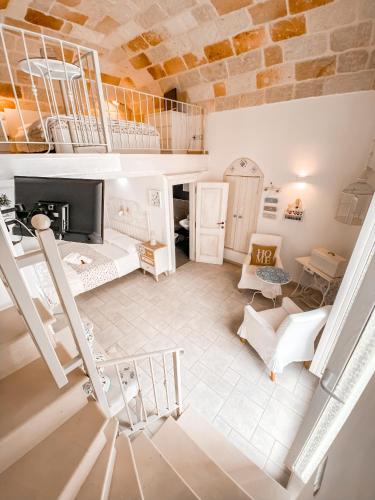 a room with a staircase and a living room at Karen House B&B in Polignano a Mare