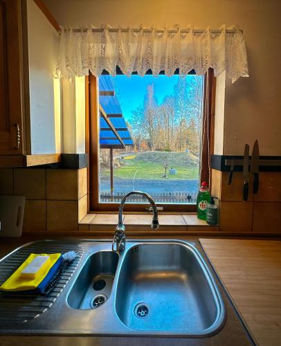 a kitchen sink with a view of a window at Barts house in Länshult
