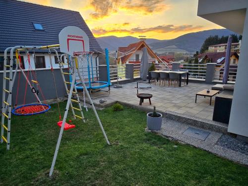 a playground on the roof of a house at Dom pri jazere Nitrianske Rudno in Kostolná Ves