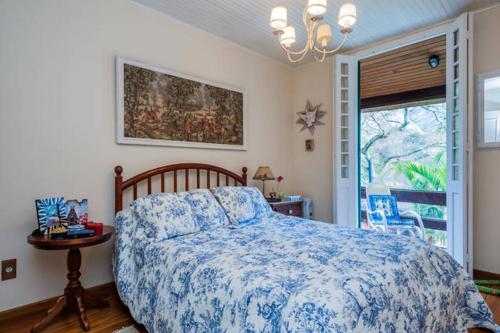Un pat sau paturi într-o cameră la PASSAREDO - Casa de Campo Fazenda Inglesa