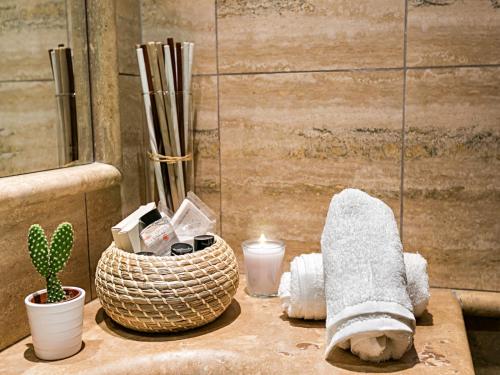 a table with a towel and a cactus and candles at Hotel Diplomatic in Rome