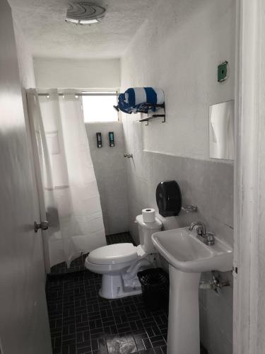 a bathroom with a toilet and a sink at Casa completa en Puente Moreno Ver in Playa de Vacas