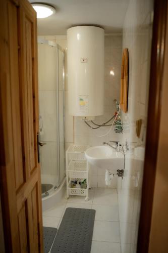 a bathroom with a sink and a shower at Privat Luna in ľubeľa