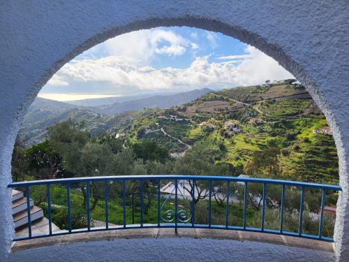 a view from a window of a mountain view at B&B la Madrugada in Cómpeta